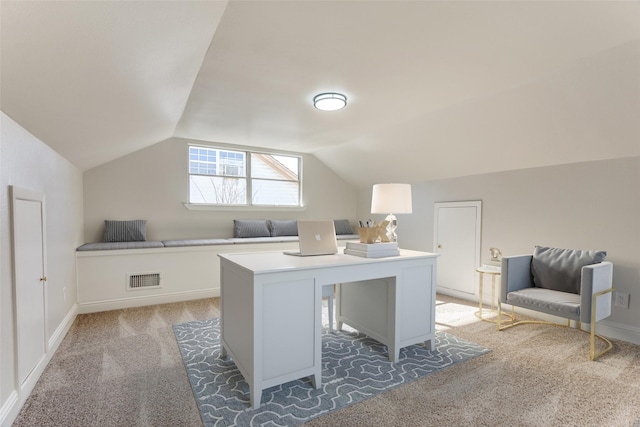 office space featuring lofted ceiling and dark colored carpet