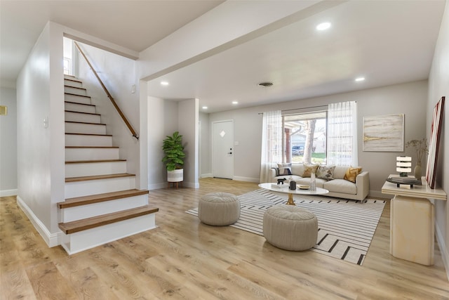 living room with light hardwood / wood-style floors