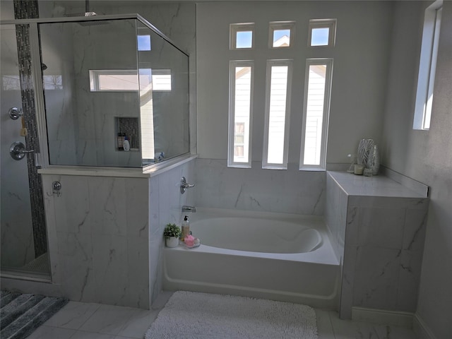 bathroom featuring plus walk in shower