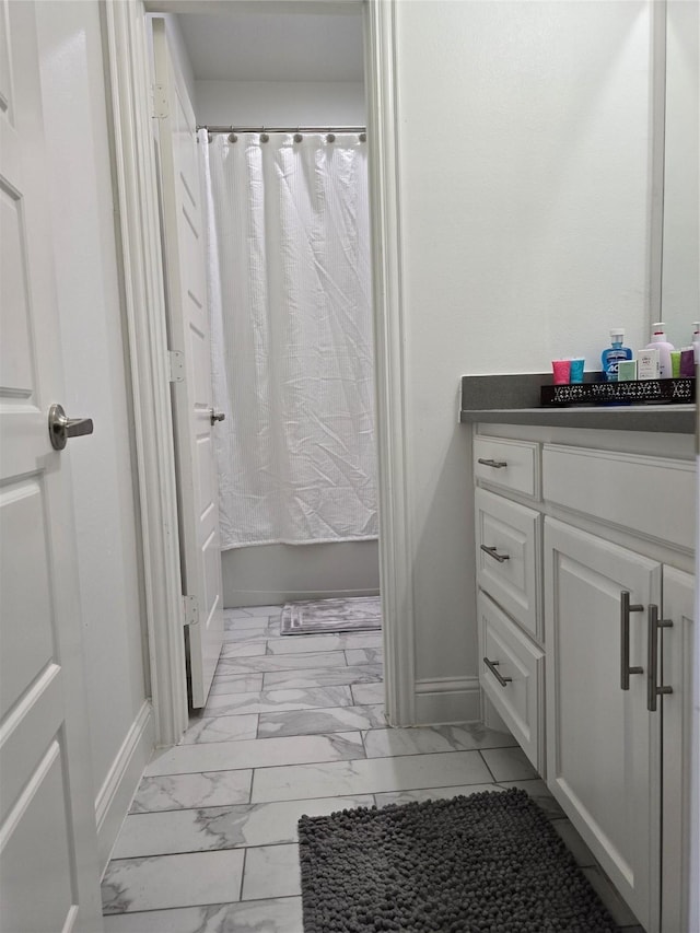 bathroom with vanity and shower / bath combo with shower curtain