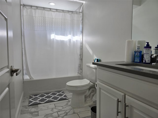 full bathroom with vanity, shower / tub combo, and toilet