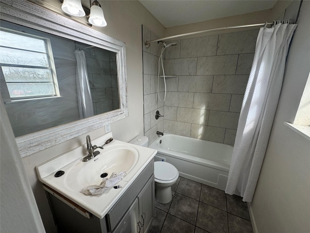 full bathroom featuring tile patterned floors, shower / bath combo with shower curtain, vanity, and toilet