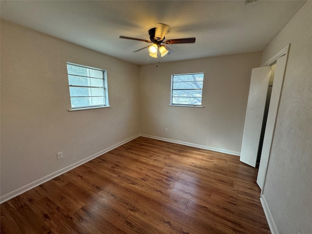 spare room with wood-type flooring and ceiling fan