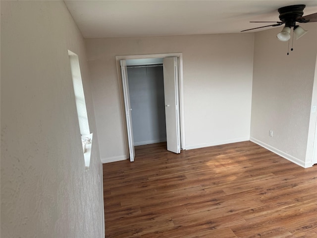 unfurnished bedroom with a closet, ceiling fan, and hardwood / wood-style floors