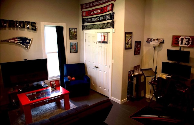 living room with dark hardwood / wood-style flooring