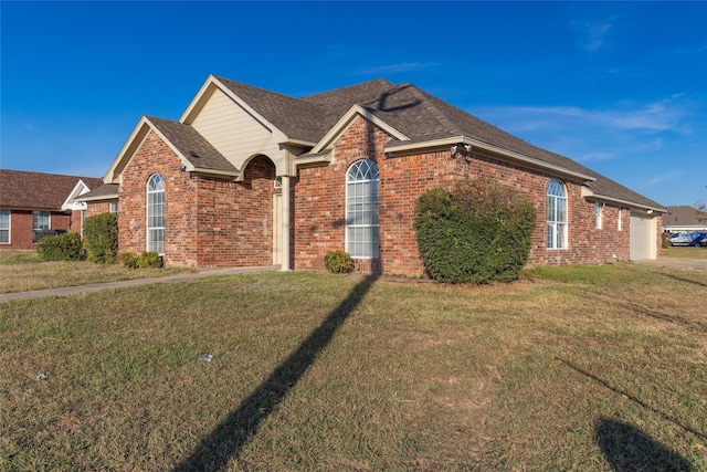 front of property with a garage and a front yard