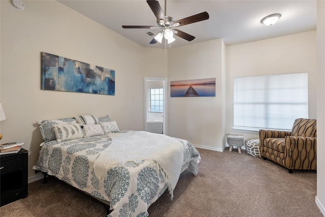 carpeted bedroom featuring multiple windows, ceiling fan, and ensuite bathroom