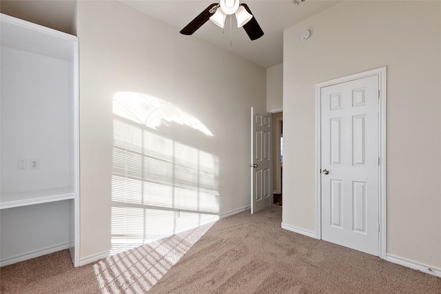 unfurnished bedroom featuring ceiling fan and light carpet