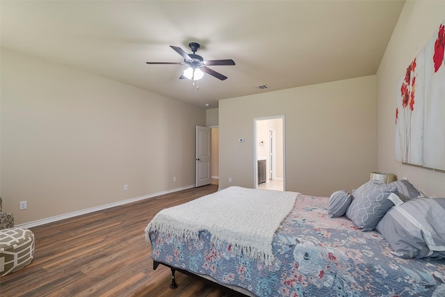 bedroom with ceiling fan and dark hardwood / wood-style floors