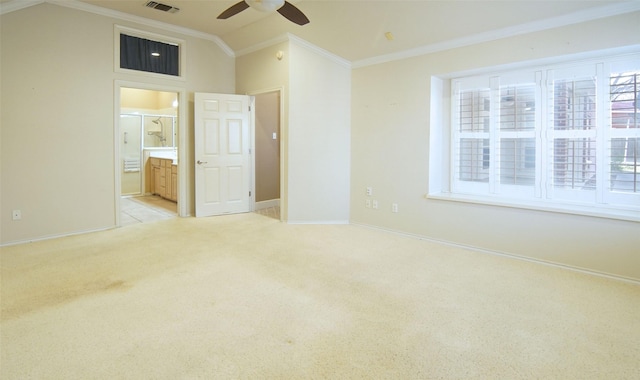 unfurnished bedroom with ensuite bathroom, lofted ceiling, light colored carpet, ceiling fan, and crown molding