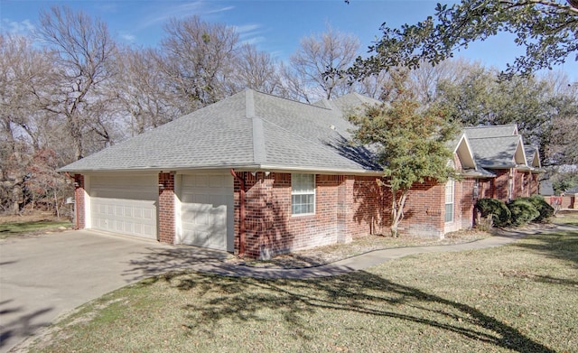 view of front of house with a front yard and a garage