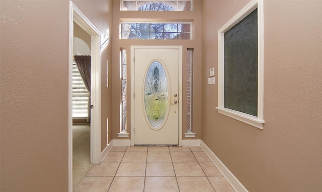 foyer with light tile patterned flooring