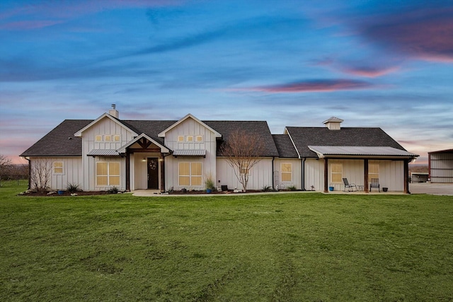 view of front of house with a yard