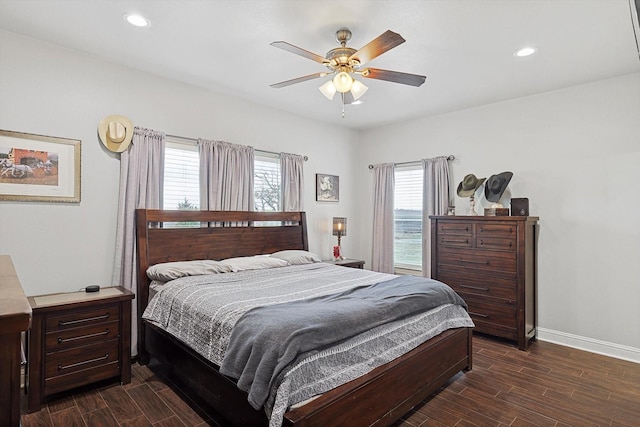 bedroom with multiple windows and ceiling fan