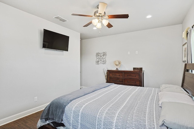 bedroom with ceiling fan and dark hardwood / wood-style floors