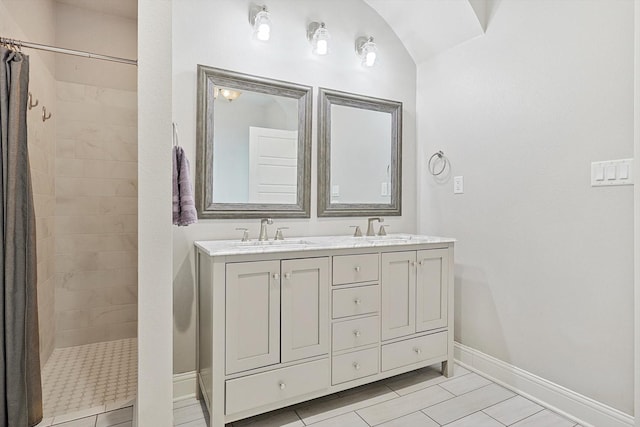 bathroom featuring tile patterned floors, vanity, lofted ceiling, and walk in shower