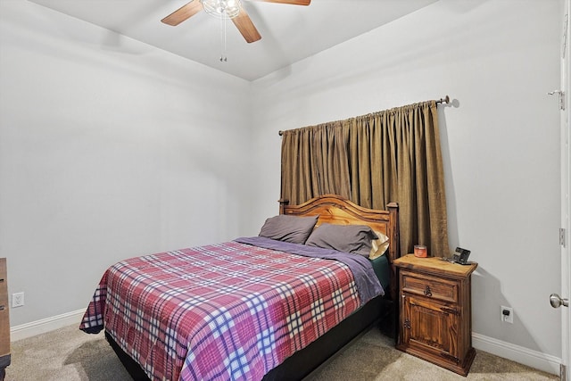 bedroom featuring ceiling fan and light carpet