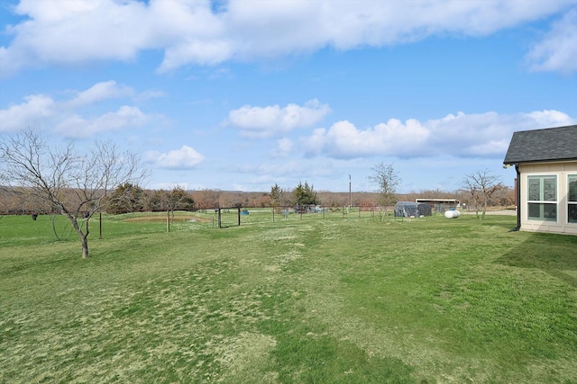 view of yard with a rural view