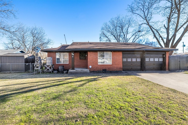 single story home featuring a front lawn and a garage