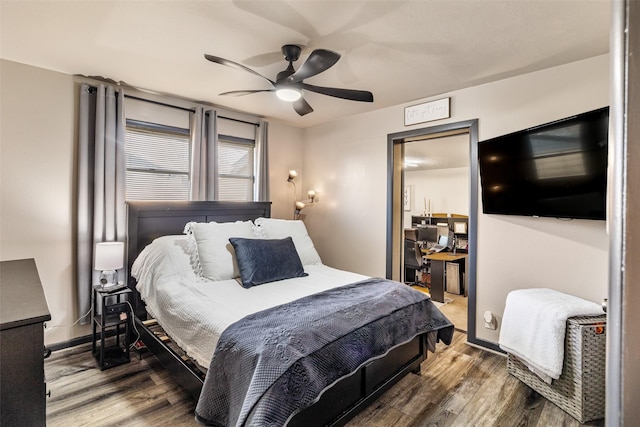 bedroom featuring hardwood / wood-style floors and ceiling fan