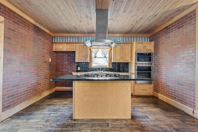 kitchen featuring light brown cabinets, island exhaust hood, and stainless steel appliances