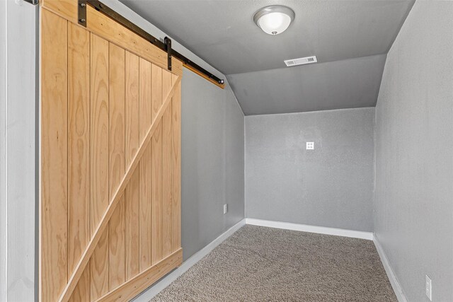 unfurnished bedroom with ceiling fan, wood finished floors, visible vents, wood ceiling, and ornamental molding