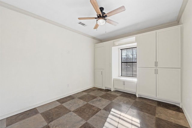 unfurnished bedroom featuring a ceiling fan, visible vents, crown molding, and baseboards