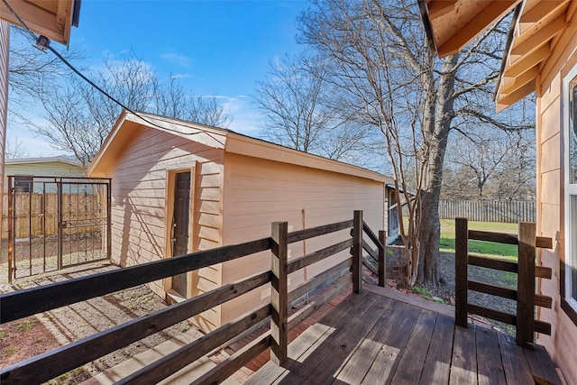 wooden terrace featuring fence