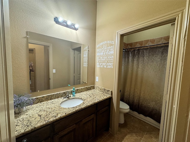 full bathroom with vanity, tile patterned flooring, shower / bath combination with curtain, and toilet