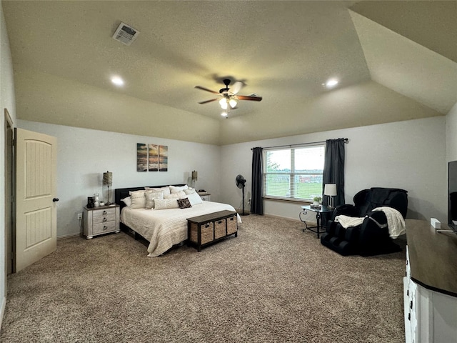 bedroom with ceiling fan, carpet flooring, vaulted ceiling, and a textured ceiling