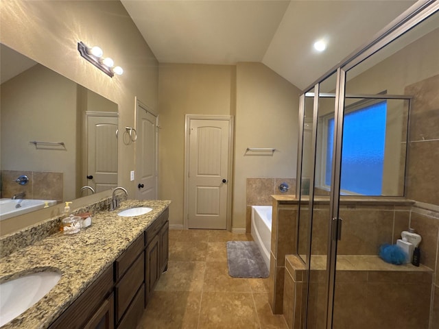 bathroom featuring lofted ceiling, vanity, and plus walk in shower