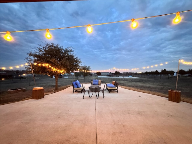 view of patio terrace at dusk