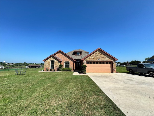 view of front of house with a garage and a front lawn