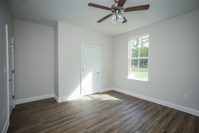 unfurnished room featuring ceiling fan and dark hardwood / wood-style flooring