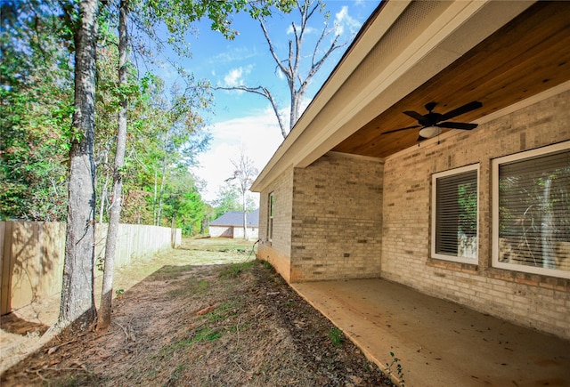 view of yard featuring ceiling fan