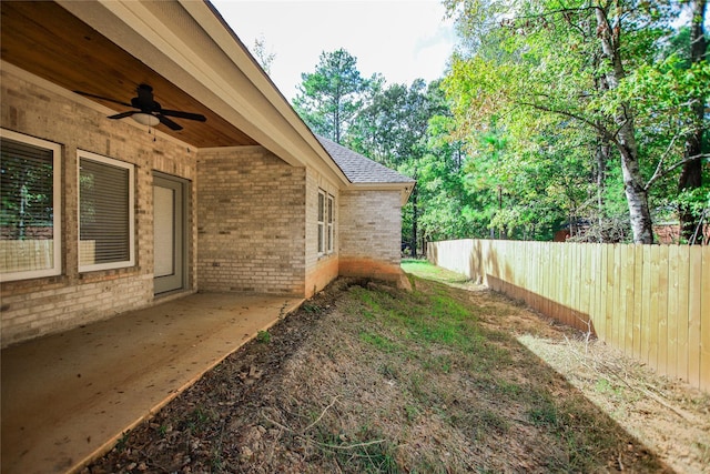 view of yard featuring ceiling fan