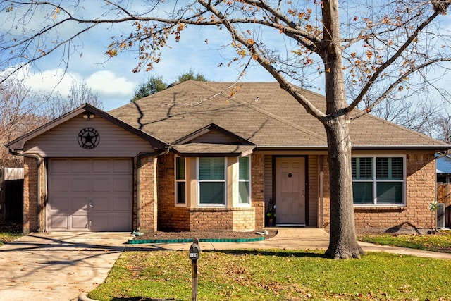 single story home with a garage and a front lawn