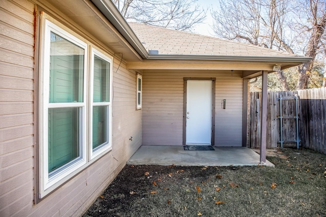 entrance to property featuring a patio