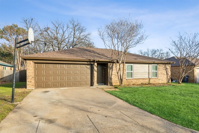 single story home with a garage and a front lawn