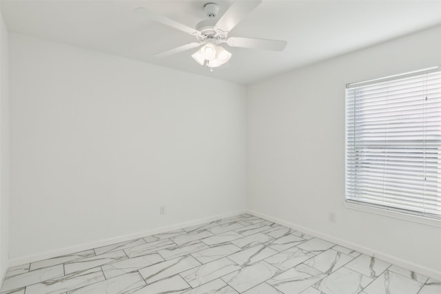 spare room with ceiling fan