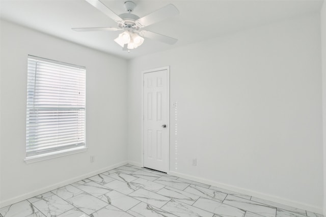 spare room featuring ceiling fan