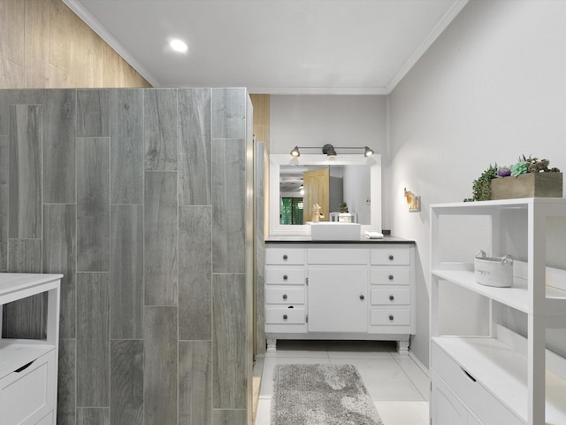 bathroom with walk in shower, vanity, and crown molding