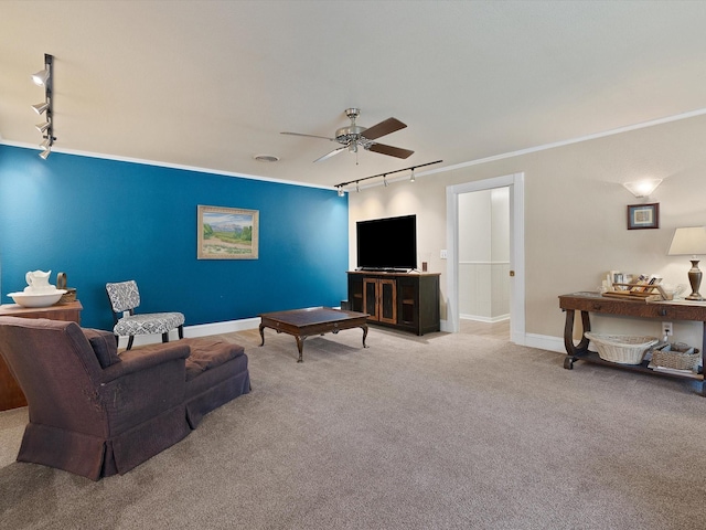 carpeted living room with crown molding, rail lighting, and ceiling fan