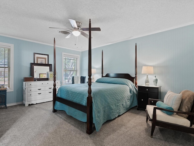 bedroom with crown molding, carpet floors, a textured ceiling, and ceiling fan