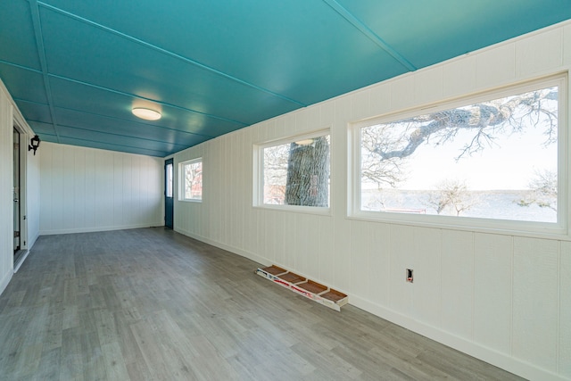 spare room with hardwood / wood-style floors