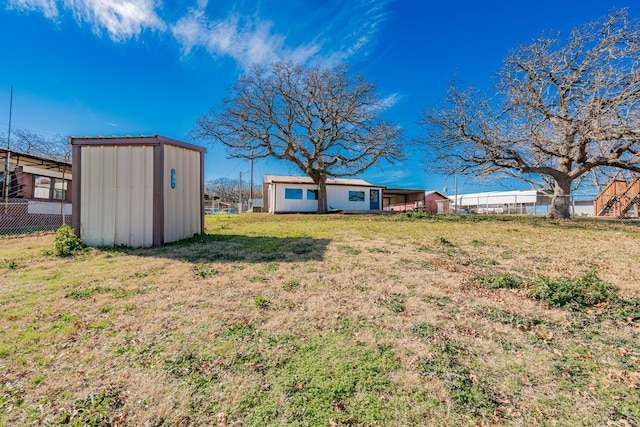 view of yard with a storage shed