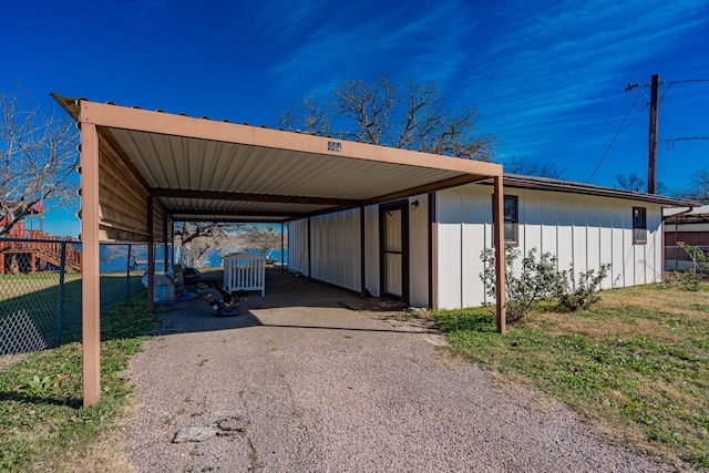 view of vehicle parking with a carport