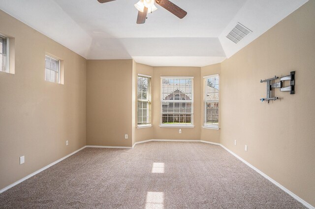 unfurnished living room with a fireplace, ceiling fan, light hardwood / wood-style flooring, and a towering ceiling