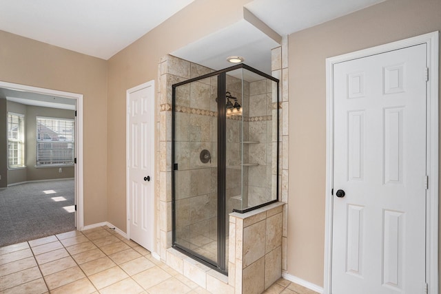 bathroom featuring walk in shower and tile patterned floors