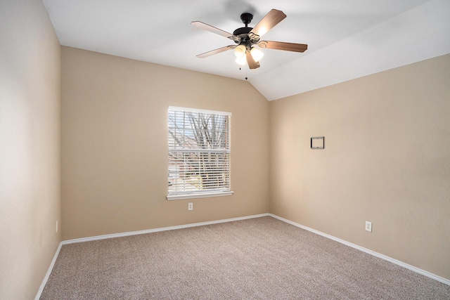 unfurnished room with lofted ceiling, carpet floors, and ceiling fan